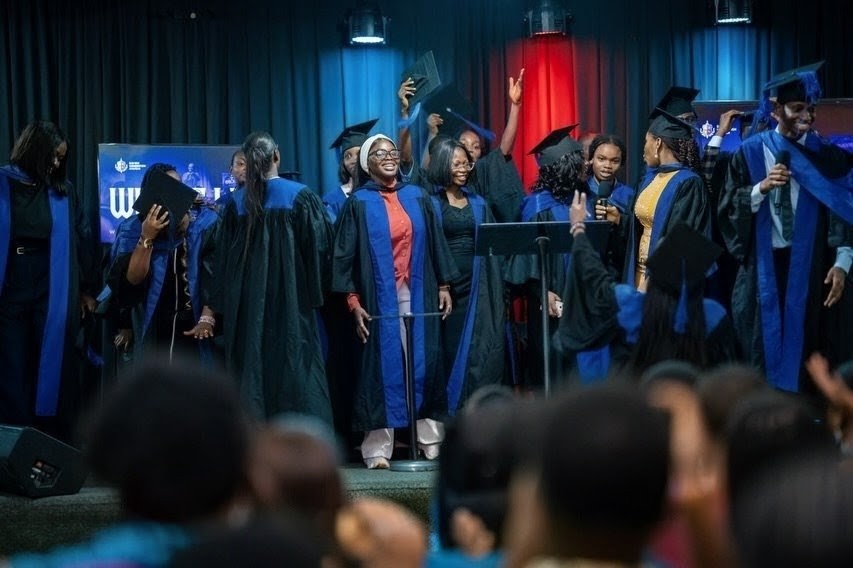 Celebration on stage at a DGC Foundation School graduation ceremony