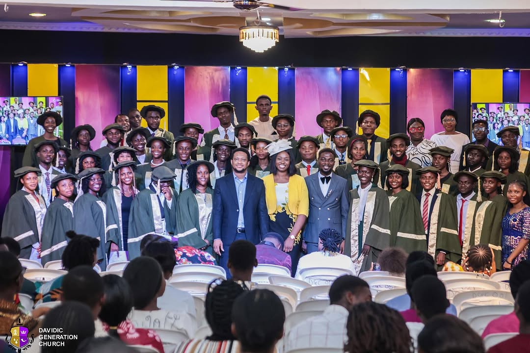 A group of DGC Foundation School graduates posing together on stage
